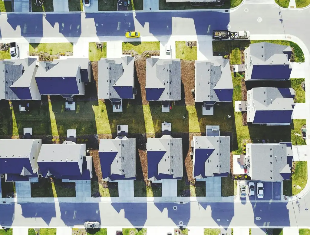 Aerial view of rows of rooftops in a residential neighborhood